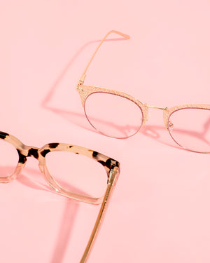 Photograph of Coco and Varli by Glamour Glasses with pink background 