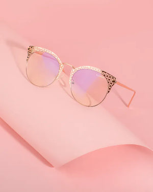 Photograph of Coco by Glamour Glasses with pink background 