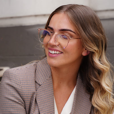 @jordirendell wearing Coco by Glamour Glasses featuring metal flower patter in rose-gold - 45 degree top shot