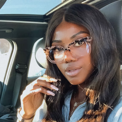 @ambitious_x wearing Varli by Glamour Glasses featuring an oversized leopard print and champagne-rose frame