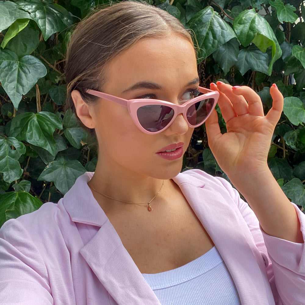 @bellebenton wearing Milah Sunglasses by Glamour Glasses featuring a bold salmon pink cat eye frame