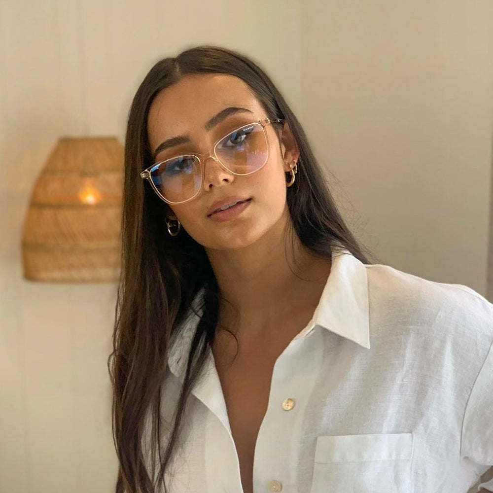@catalinemeldrum wearing Pink Ice by Glamour Glasses featuring a transparent light pink acetate frame and golden temples