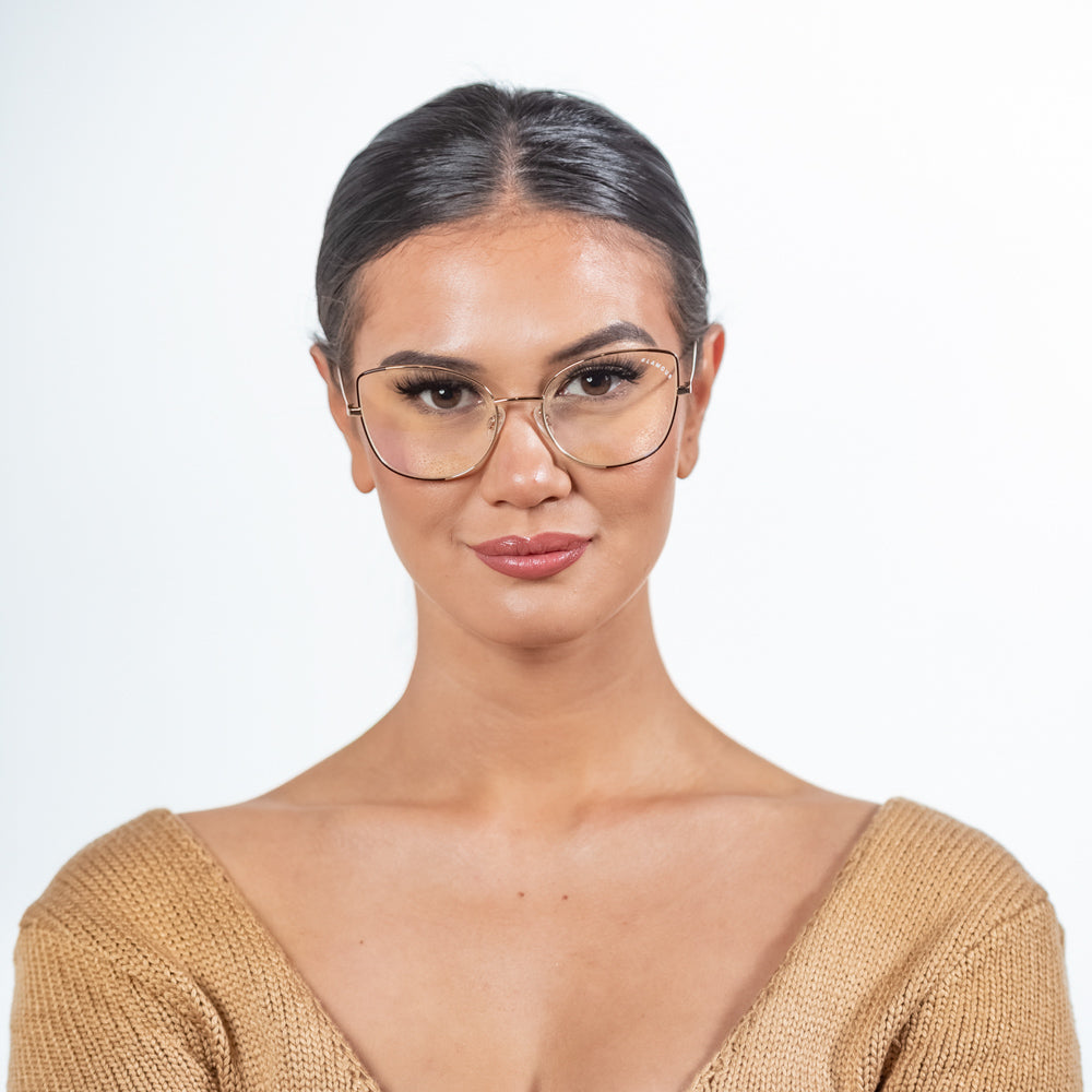 @gaellcameron wearing Foxy by Glamour Glasses featuring a oversized cat-eye frame in a delicate gold and brown - front shot