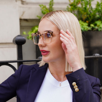 @jamsine.pring wearing Varli by Glamour Glasses featuring an oversized leopard print and champagne-rose frame