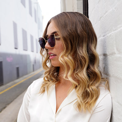 @jordirendell wearing Glamour Glasses Lexi Sunglasses featuring a thin golden cat eye frame - looking away profile shot