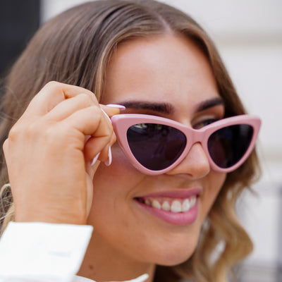 @jordirendell wearing Milah Sunglasses by Glamour Glasses featuring a bold salmon pink cat eye frame