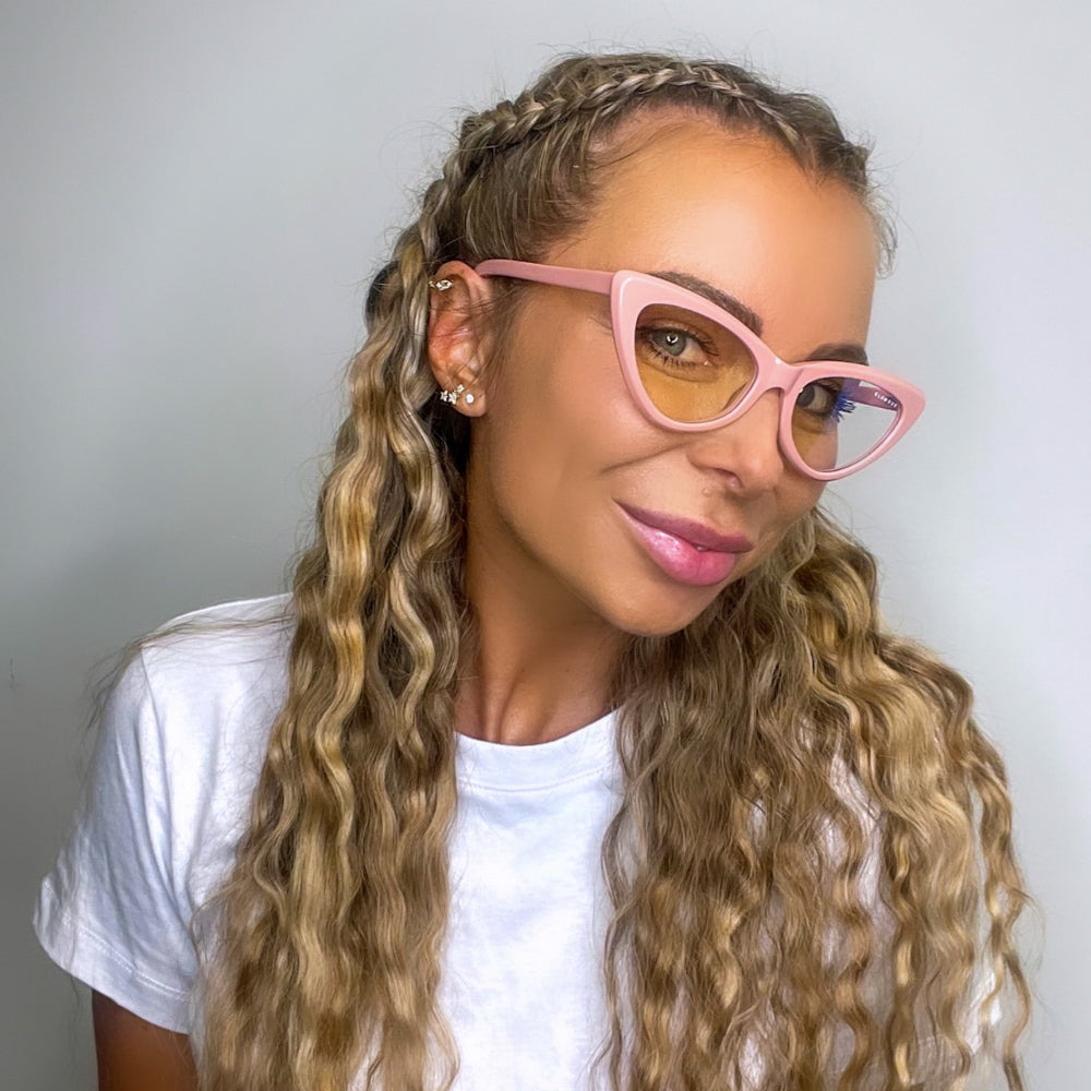 @lifeof_laylamay_zahliarae wearing Milah by Glamour Glasses featuring a bold salmon pink cat eye frame - close up shot