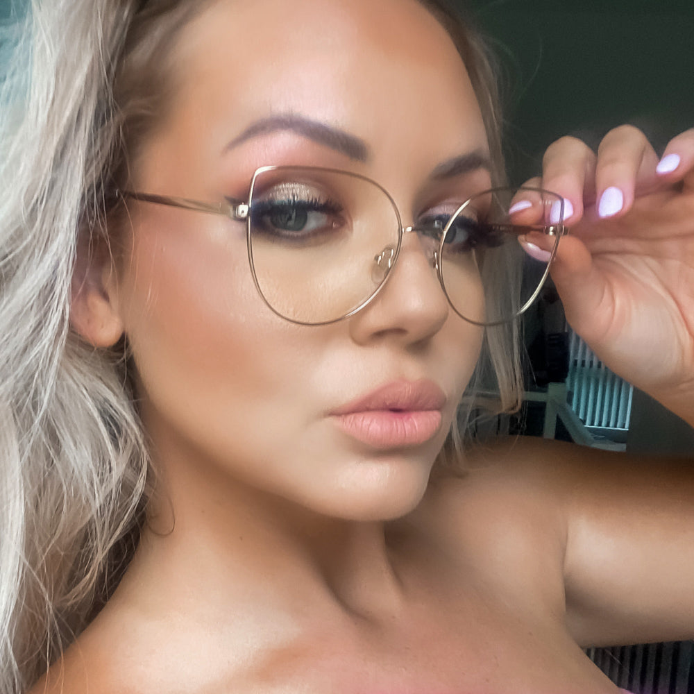 @rhiannan94 wearing Lexi by Glamour Glasses featuring a thin golden cat eye frame - front shot